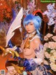 A woman with blue hair holding a sword in her hand.